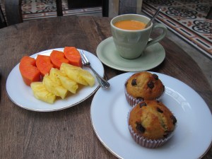 Breakfast. Fresh papaya and pineapple, a strong Thai-style tea, and banana chocolate-chip muffins.