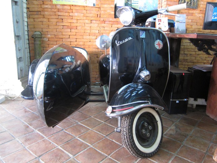 Old Vespa with sidecar. 