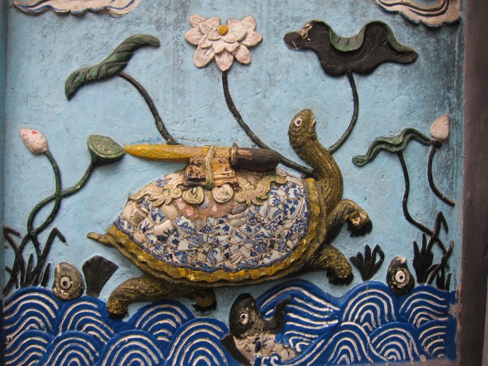 The Legend: In the mid-15th century Heaven sent Emperor Le Thai To a magical sword which he used to drive the Chinese from Vietnam. After the war a giant golden turtle took the sword and swam into the lake to restore the sword to its divine owners. Thus the name Ho Hoan Kiem (Lake of the Restored Sword).