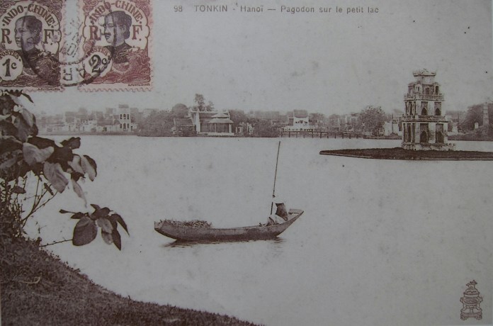 Image of an old postcard of Hoan Kiem Lake, from a display of old photographs near the lake. 